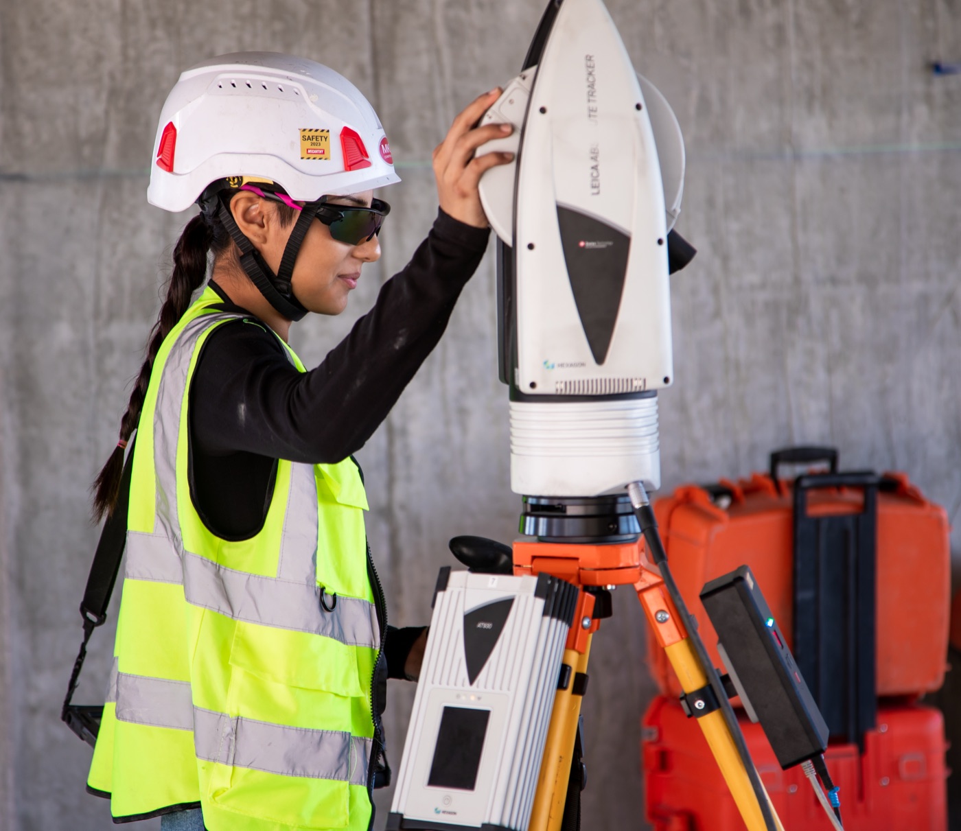 Layout specialist operating a laser tracker